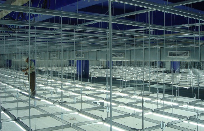 Prefabricated semiconductor cleanroom ceiling service grid installed above cleanroom panels