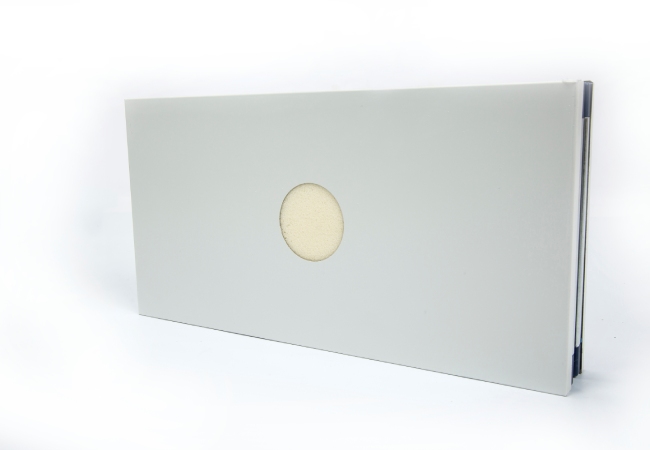 Real cleanroom wall panel with factory prepared circular penetration for service routing