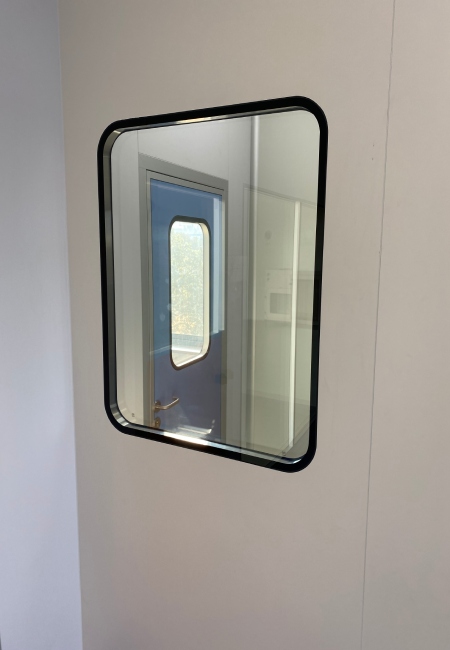 Real cleanroom flush vision window integrated into medical lab wall panel partition