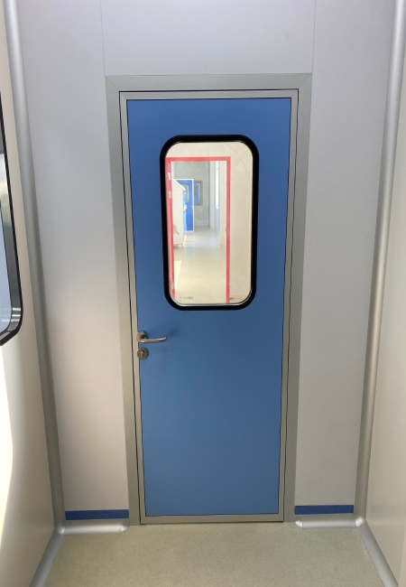 Real cleanroom partition with door and vision window for ISO 8 medical device assembly area